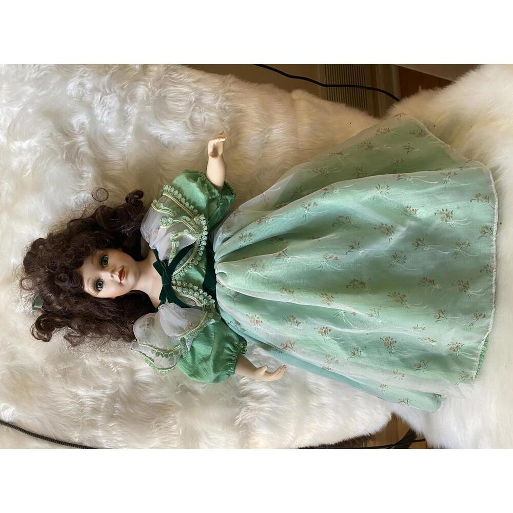 Vintage Porcelain Doll with Curly Brown Hair in Green Dress